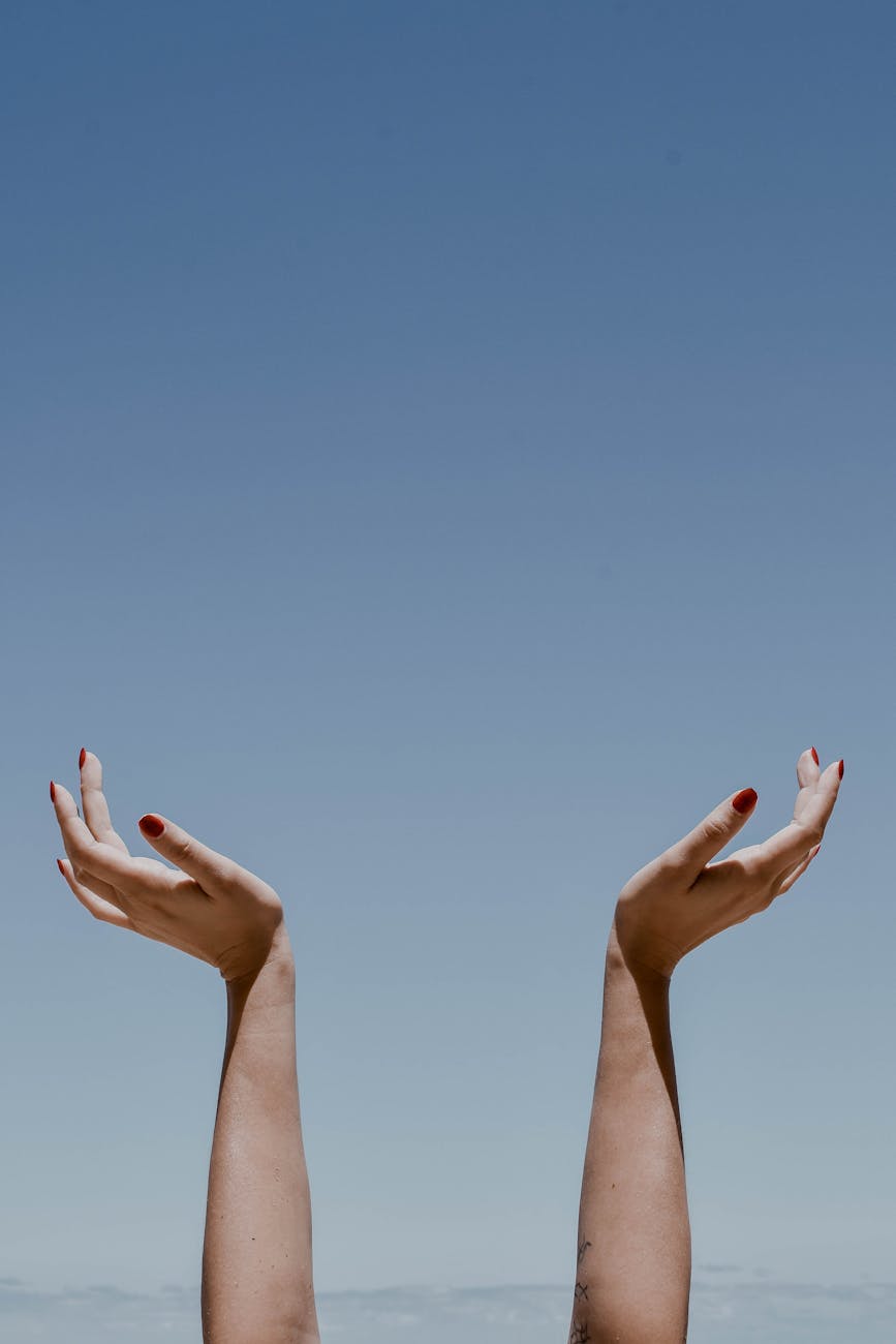 blue sky over hands